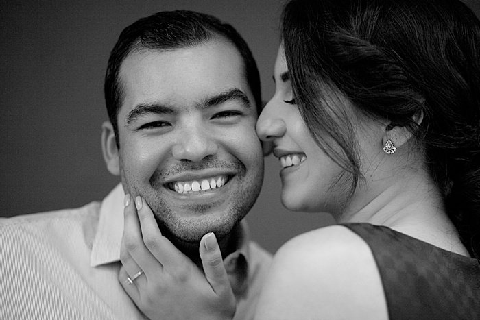 Close up black and white portrait of a couple smiling