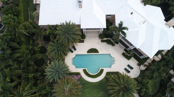Drone photo of a house with a pool
