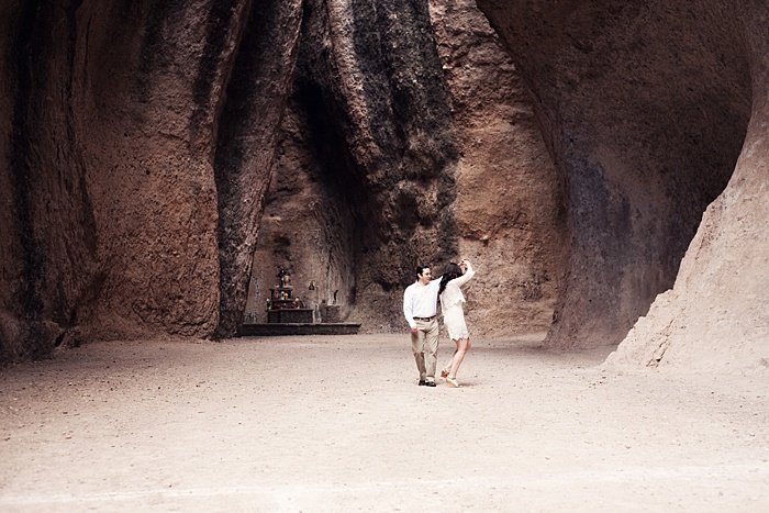 a romantic portrait of a couple dancing in a cave