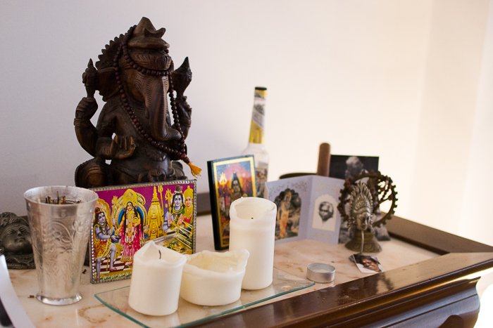 a still life featuring spiritual icons and candles 