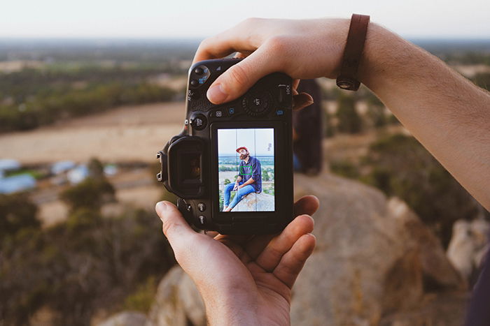 Photo of hands holding a camera