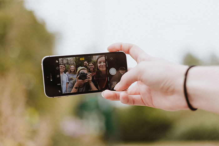 a person taking a photo with a smartphone