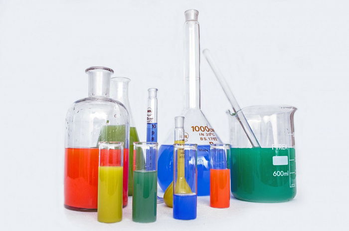 Photo of containers with different color liquids