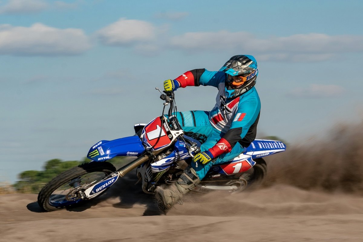 A dirt bike rider making a turn at high speed as an example of motorsports photography