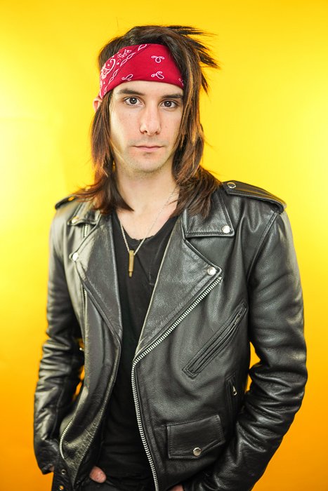 Portrait photo of a man in a leather jacket shot using paramount lighting