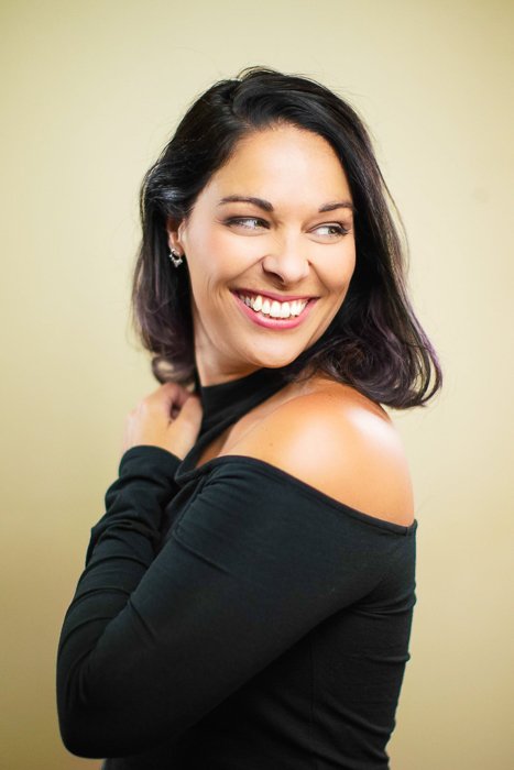 Portrait photo of a woman with neutral background