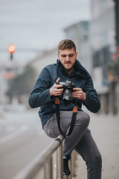 Photo of a photographer with a camera