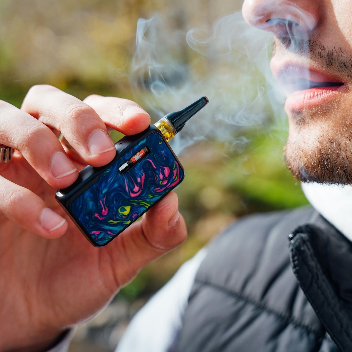 Close-up product shot of a person vaping as an example of photography style
