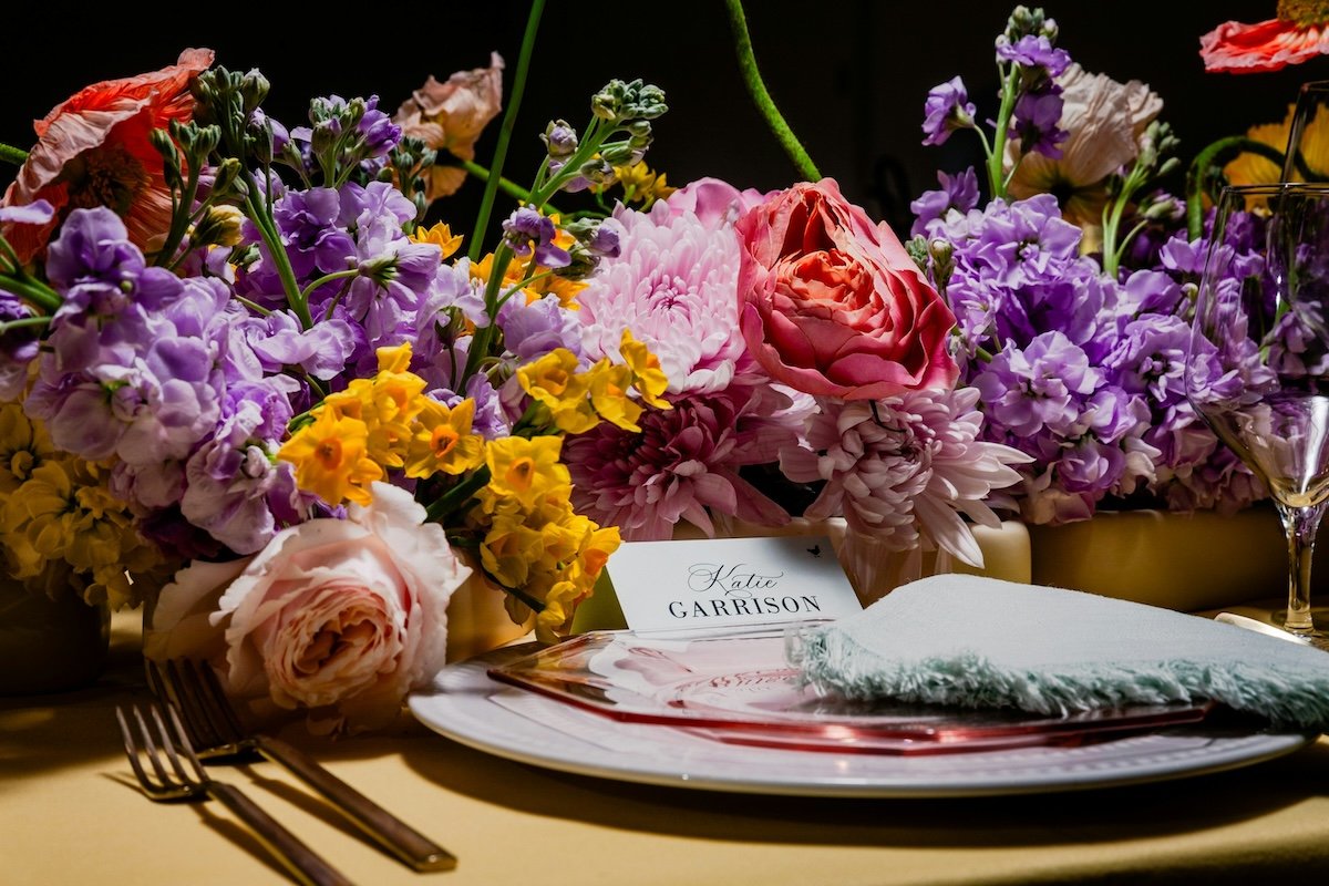 Flowers and table settings at a wedding as an example of photography style