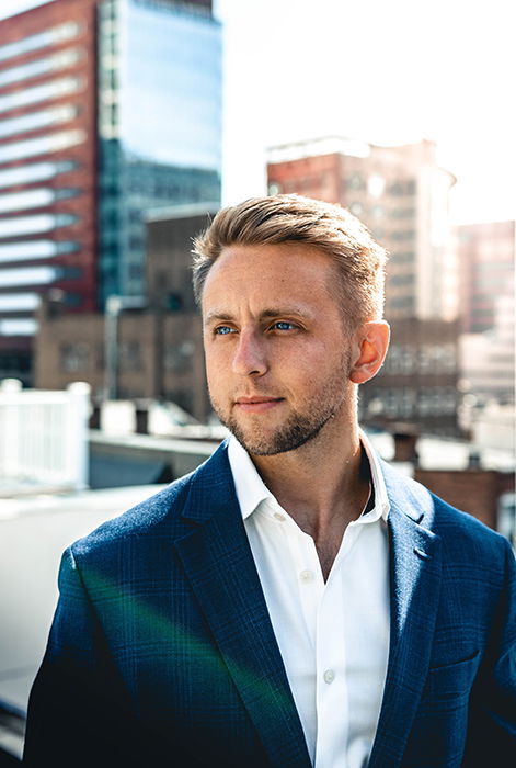 a professional headshot photo of a young man