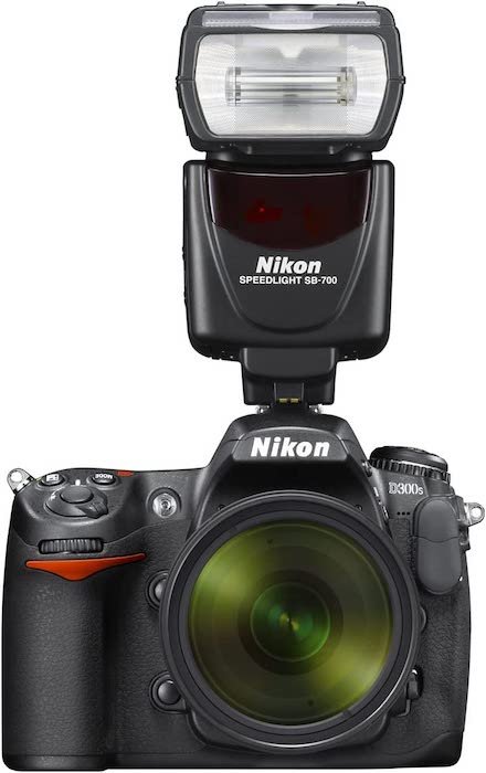 Product image of a Nikon SB-700 speedlite on a Nikon D300 DSLR camera