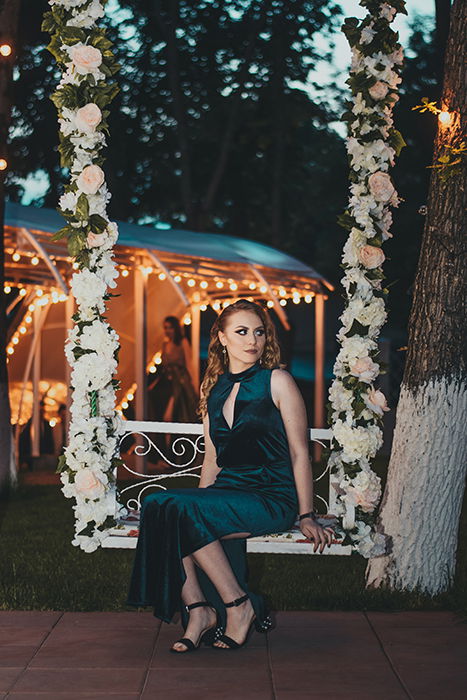 Woman on a floral swing 