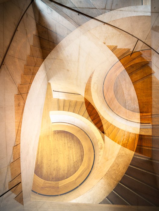Fine art photography of two layered photos of the same staircase taken from different angles. 
