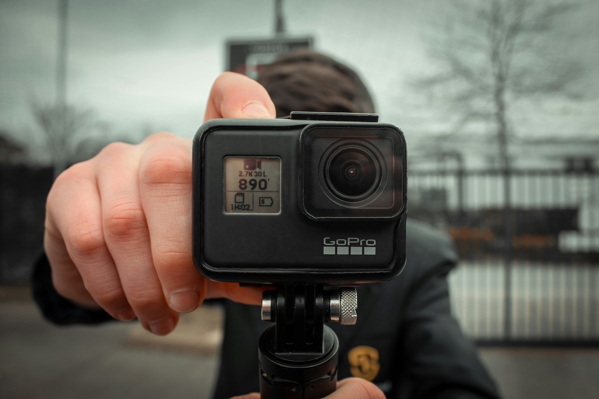 A person holding a Hero7 action camera for GoPro photography
