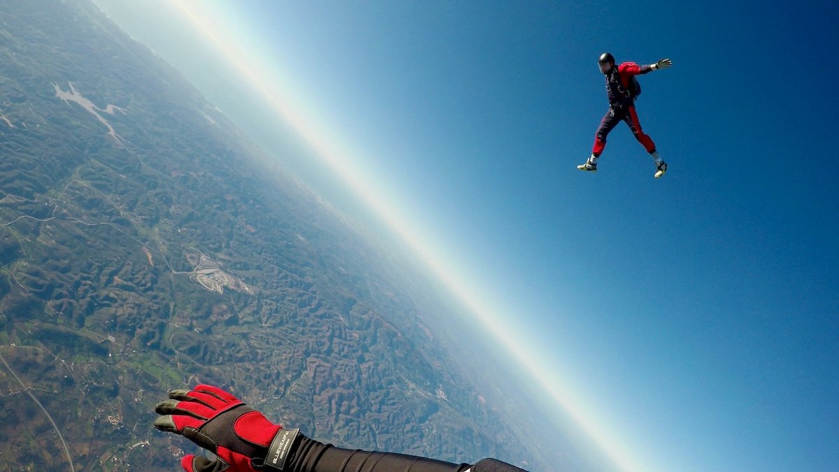 A skydiver and a skydiver's hand for GoPro photography