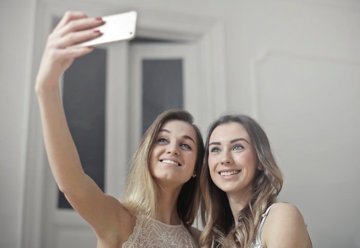 Two girls taking a selfie 
