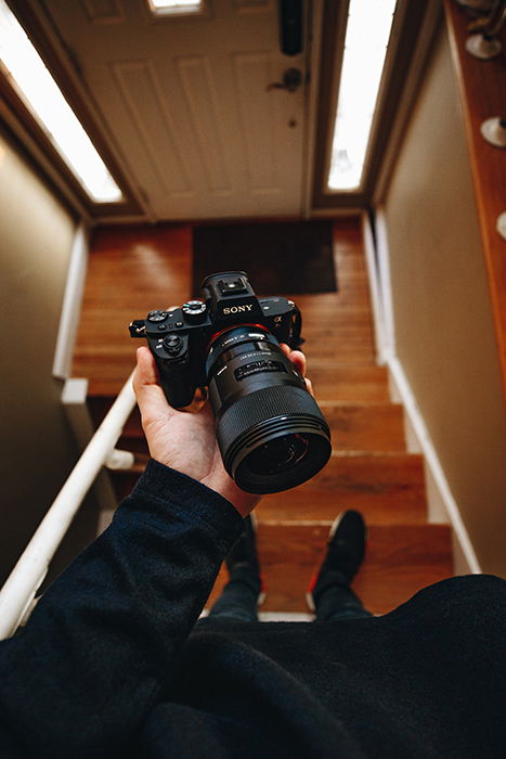 Photo of hands holding a camera