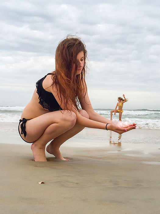 Women doing yoga and performing forced perspective.