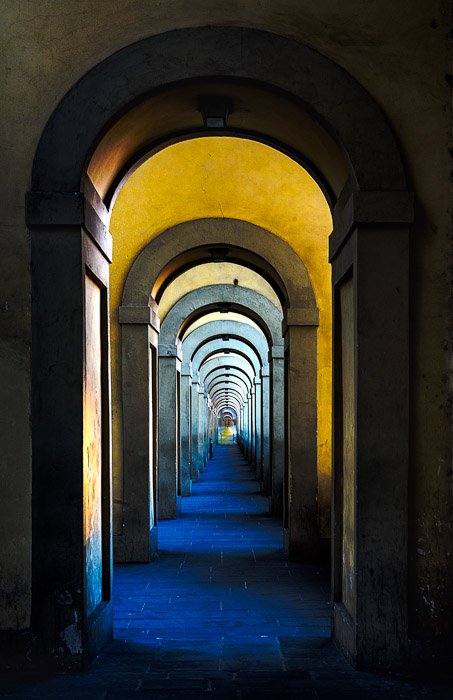 A long hallway in the interior of a grand building