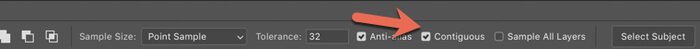 A red arrow pointing to the Contiguous selection on Photoshop options bar