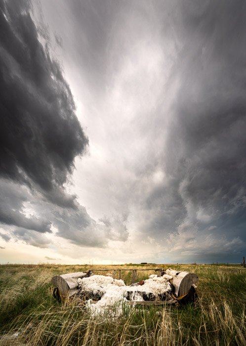 A vertical, 4-image panorama of storm clouds in the American Midwest