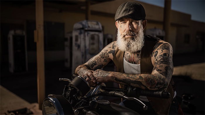 Portrait photo of a guy on a motorbike