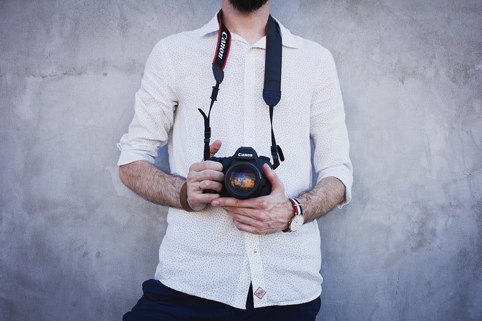 Photo of a guy holding a camera