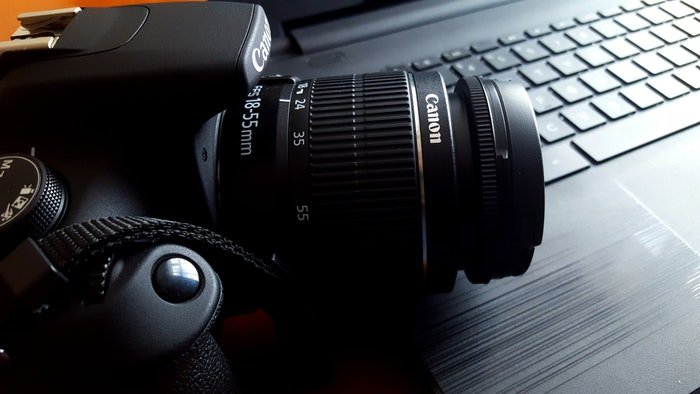 A Canon DSLR camera on a desk