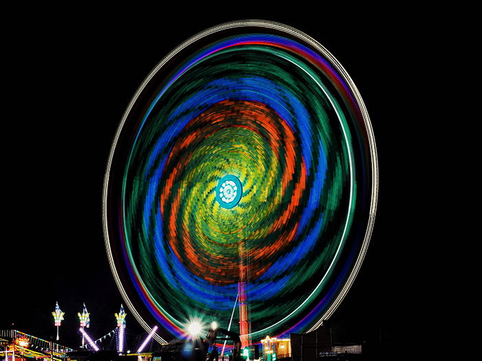 a colorful ferris wheel at night