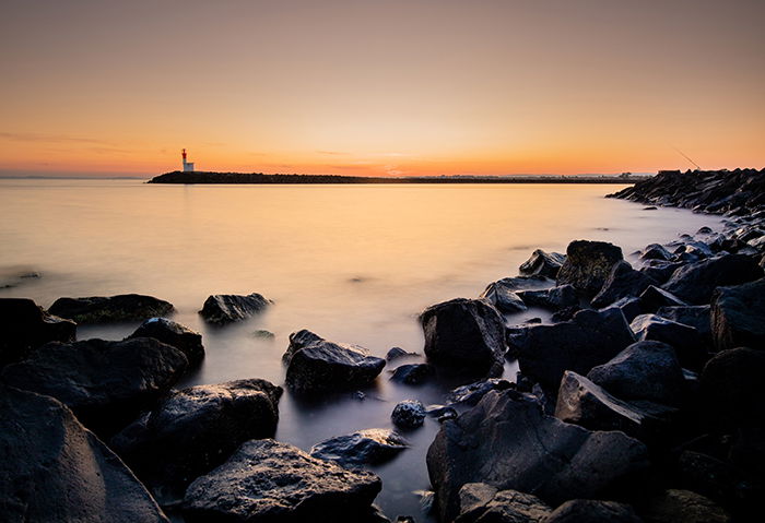 A coastal landscape at sunset