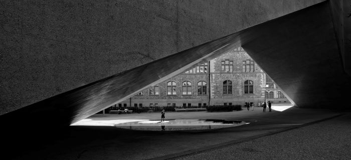 Greyscale buildings forming a triangle frame