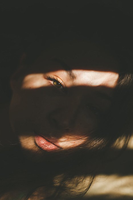 A shadowy portrait of a woman