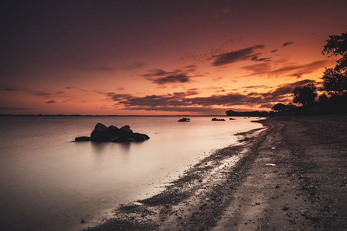 a beach at evening time