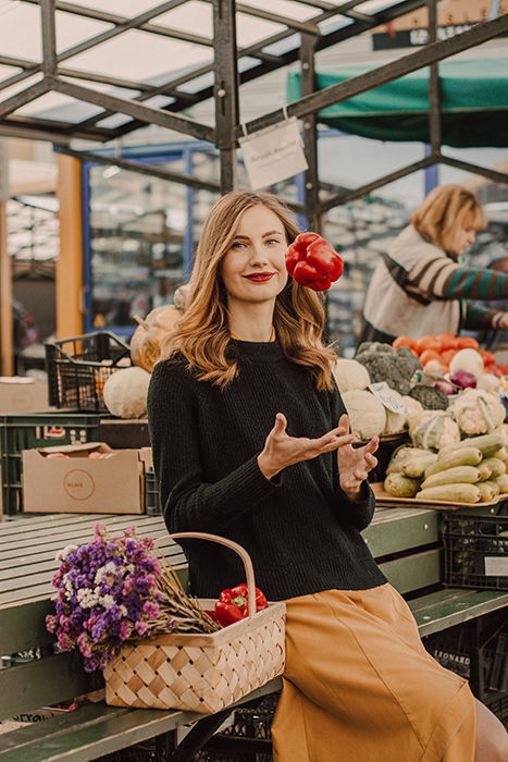 A female model sitting in a market place