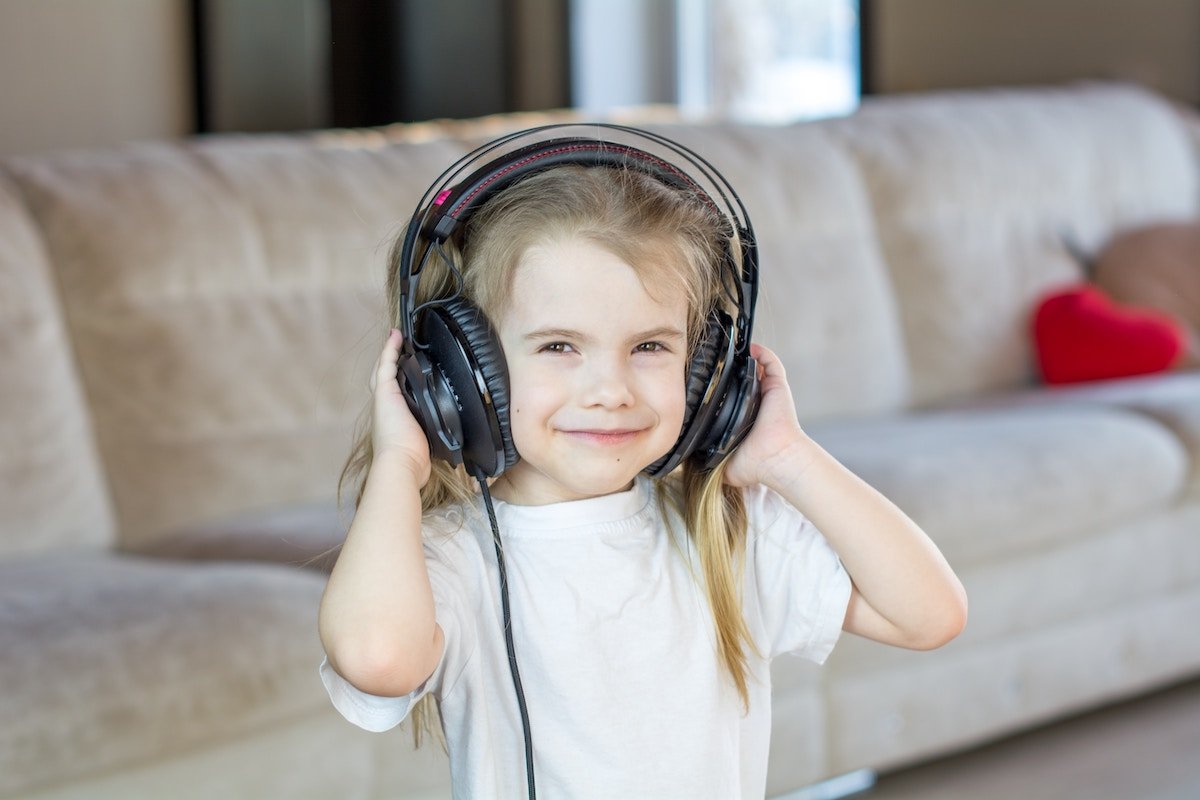 Toddler wearing large headphones