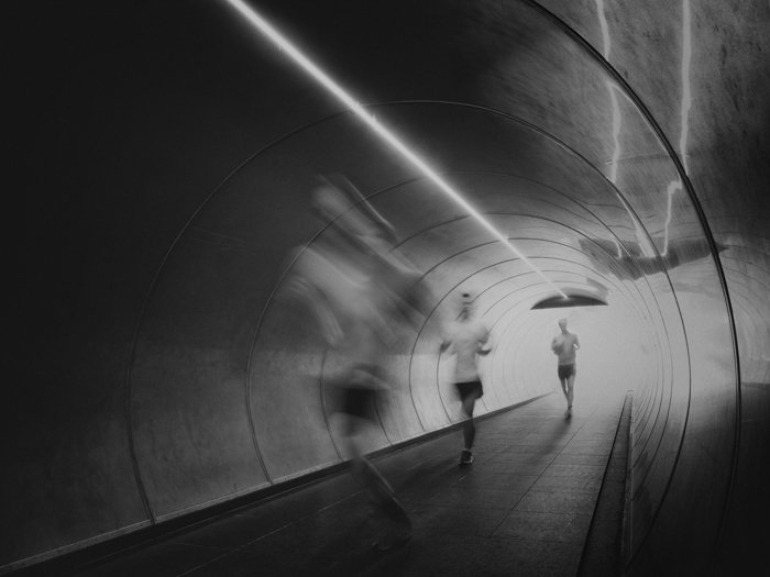 A man running through a tunnel timelapse