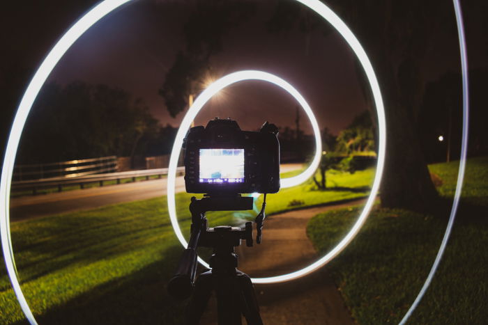 A DSLR recording light spirals at night