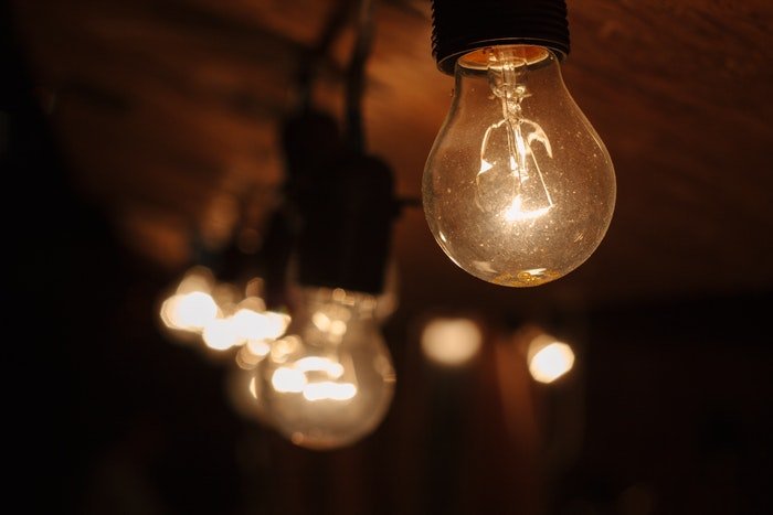 Photo of lightbulbs on a wooden ceiling