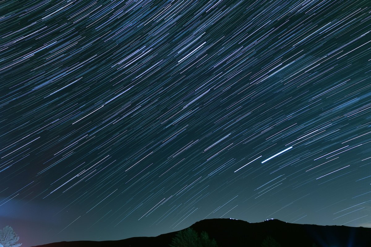 Star trails moving in a straighter line in the night sky time-lapse