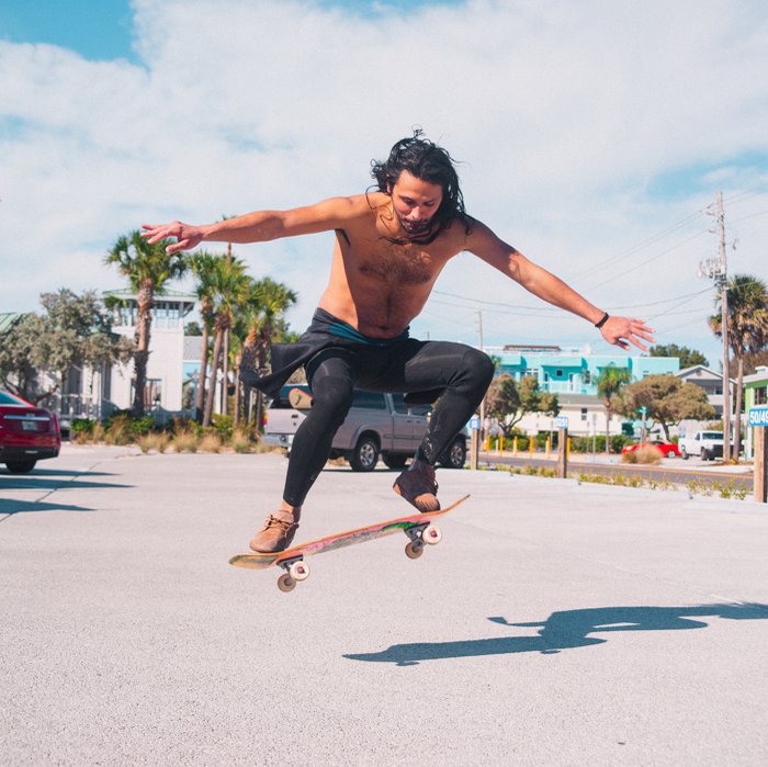 Photo of a guy doing a skateboard trick