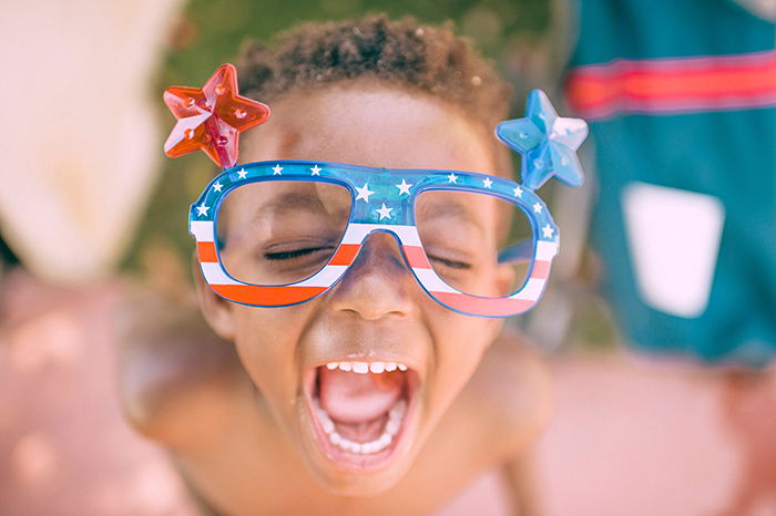 photography trend of showing bold expressions: Cute child in funny glasses