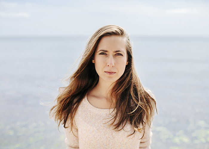 Portrait of young woman at a beach.