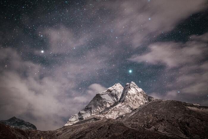 Photo of a mountain under the night sky