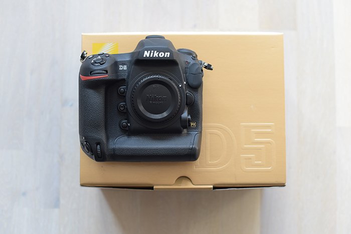 A Nikon DSLR camera on a box 