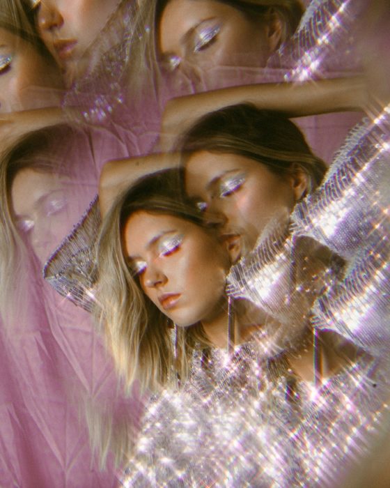 long exposure portrait of a glittery female model