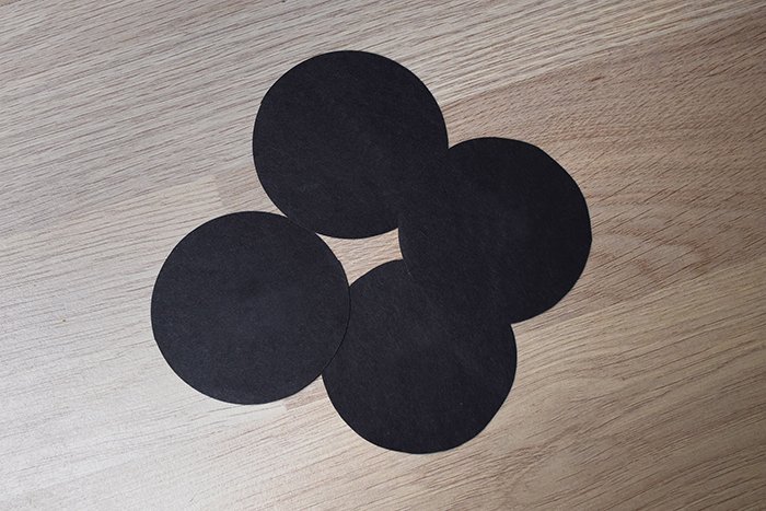 photo of circles cut out of black cardboard