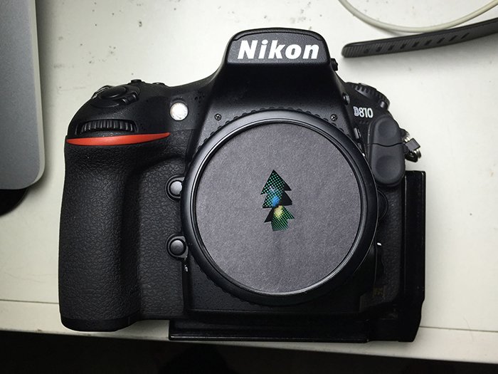 photo of a Nikon camera with a custome bokeh shape filter