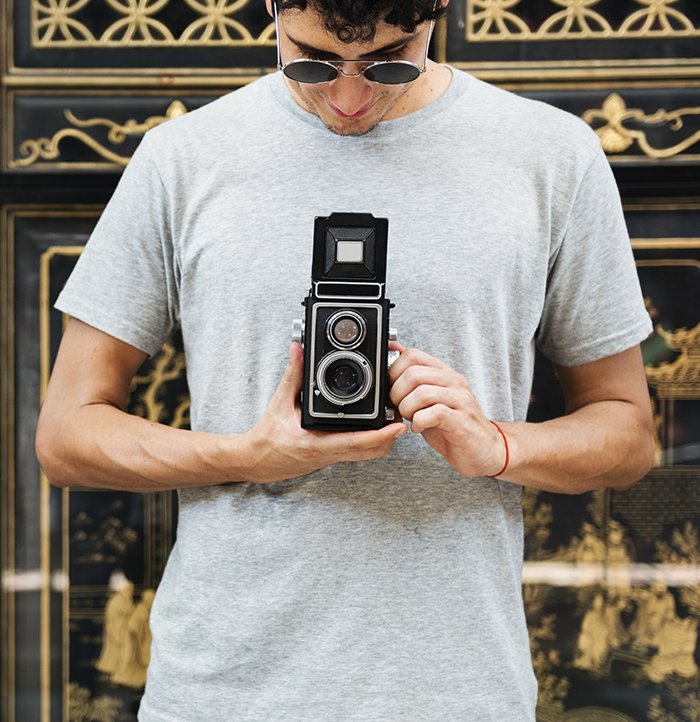 Photographer with an analog camera.