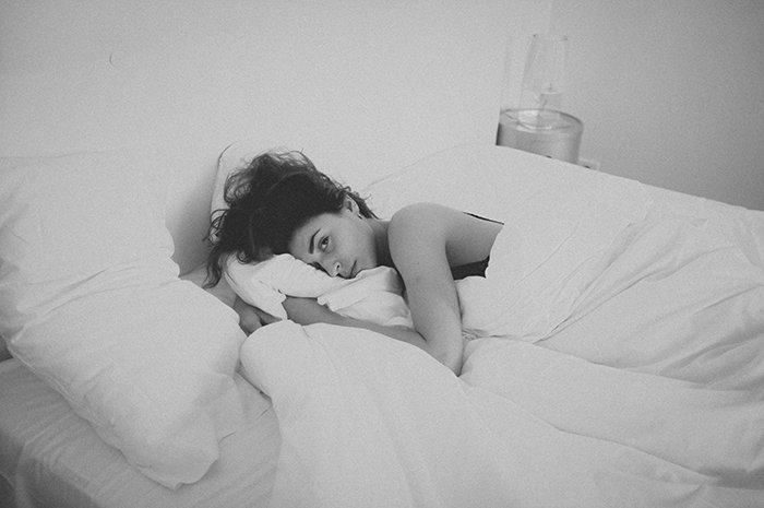 Female model posing in bed