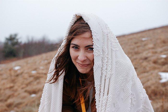 A girl wrapped in white blanket